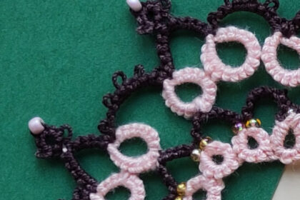 Braun-Rosa-Occhi-Spitze mit Perlen